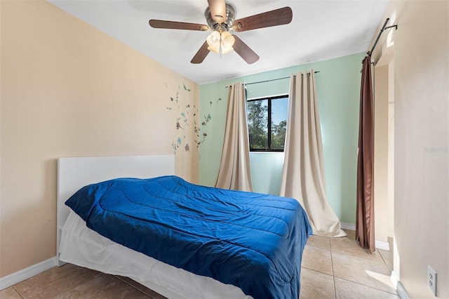 tiled bedroom with ceiling fan