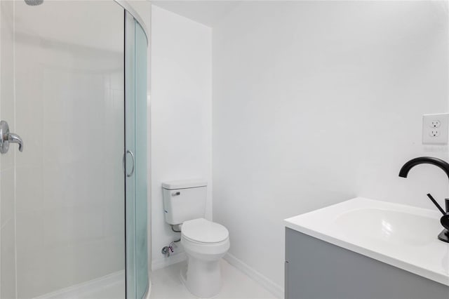 bathroom featuring vanity, toilet, and walk in shower