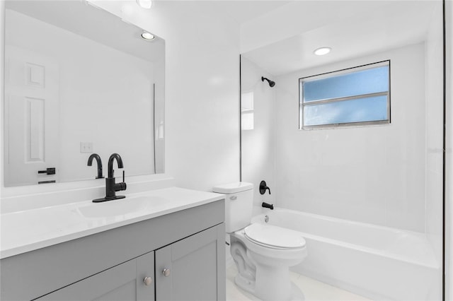 full bathroom featuring tiled shower / bath combo, vanity, and toilet