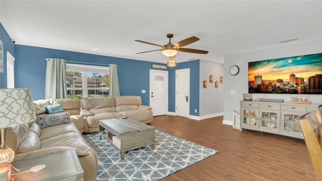 living room with hardwood / wood-style floors, a textured ceiling, and ceiling fan