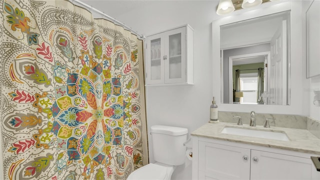 bathroom with vanity and toilet