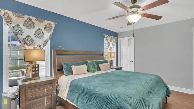 bedroom featuring hardwood / wood-style flooring and ceiling fan