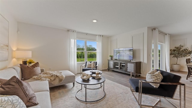 living room with light hardwood / wood-style flooring