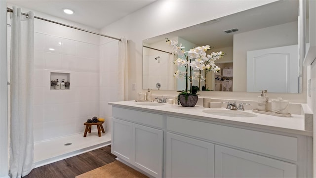 bathroom with vanity, hardwood / wood-style floors, and a shower with shower curtain