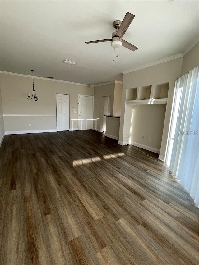 unfurnished living room with dark wood-type flooring, ceiling fan, crown molding, and built in shelves