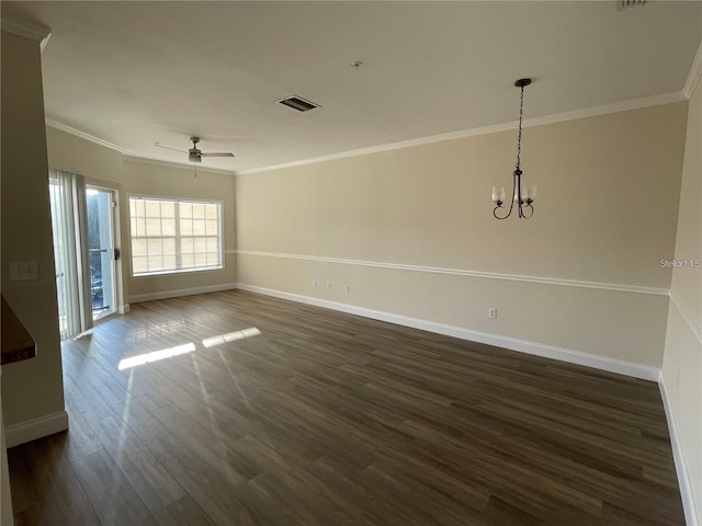 spare room featuring ceiling fan with notable chandelier, dark wood-type flooring, and ornamental molding