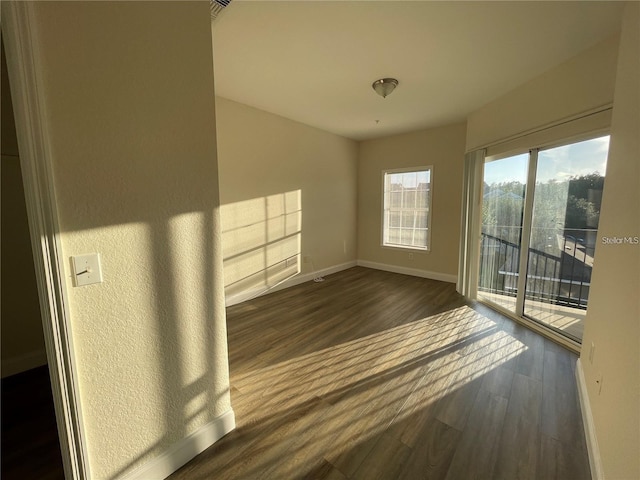 spare room featuring dark hardwood / wood-style floors