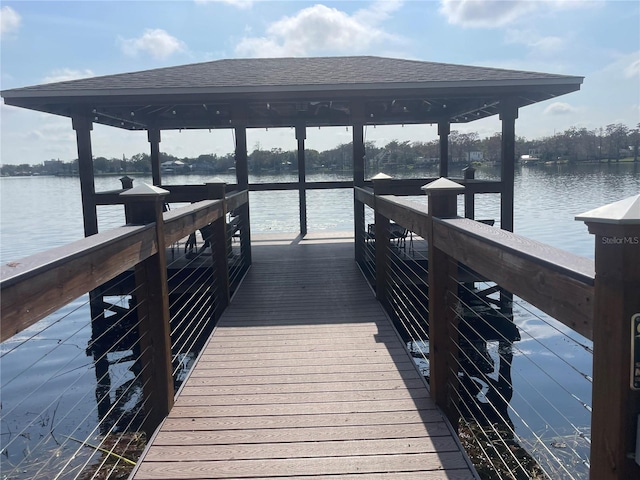 view of dock featuring a water view and a gazebo