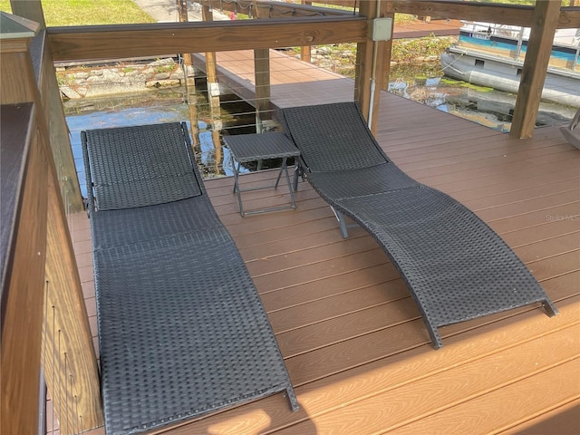 wooden terrace with a boat dock