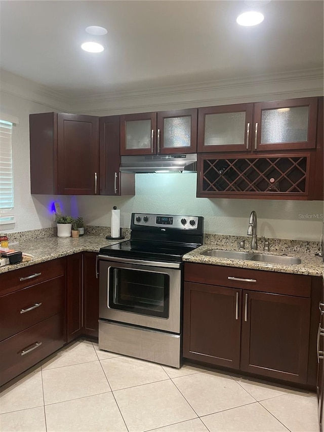 kitchen featuring stainless steel range with electric stovetop, sink, light stone countertops, and light tile patterned flooring