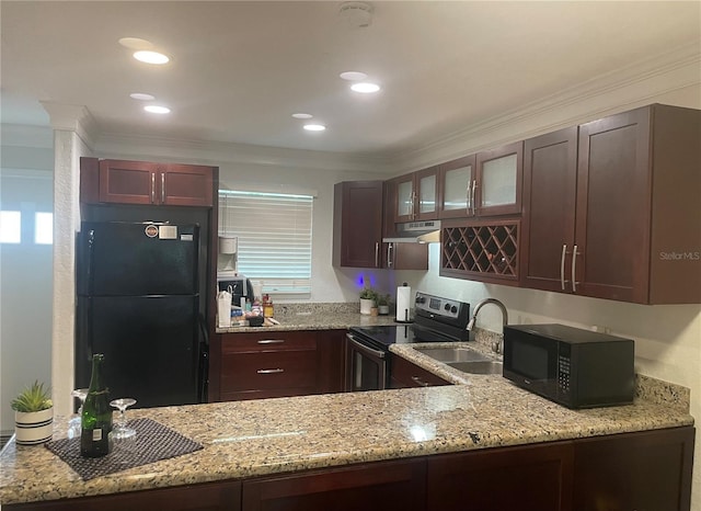 kitchen featuring crown molding, sink, light stone counters, and black appliances