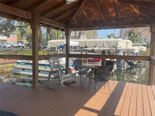 deck featuring a water view and a boat dock