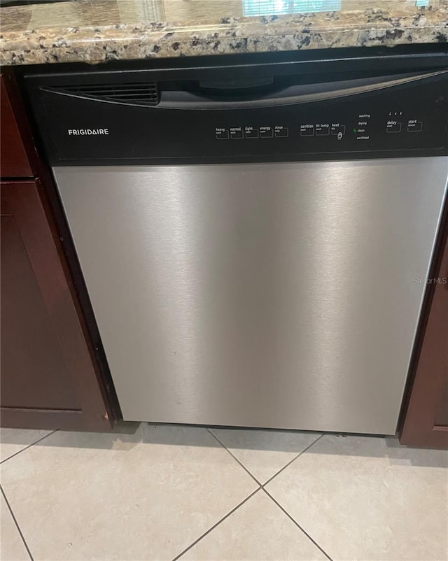 details with stainless steel dishwasher and dark brown cabinetry