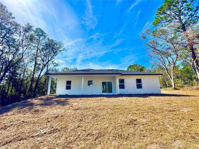 8511 N Golfview Dr, Citrus Springs, FL 34434 - rear view of property featuring a lawn