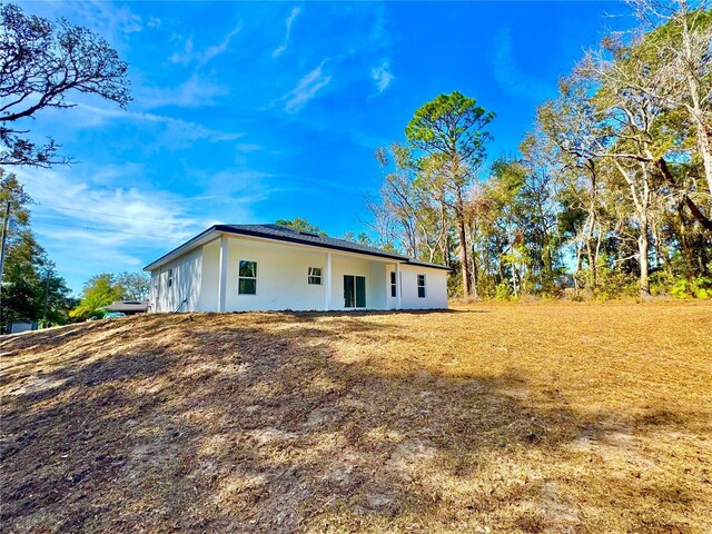 8511 N Golfview Dr, Citrus Springs, FL 34434 - view of property exterior featuring a lawn
