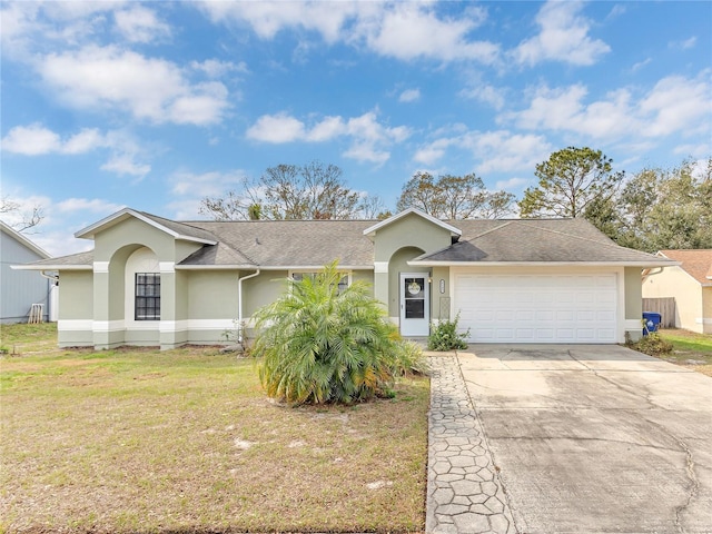 ranch-style home featuring a garage and a front yard