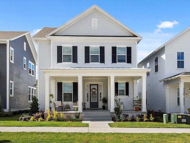 view of front of home with central AC and covered porch