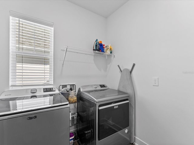 laundry room featuring washer and clothes dryer