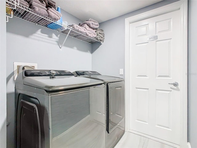 washroom with laundry area and washer and clothes dryer