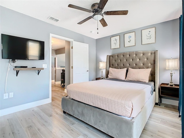 bedroom with light wood-style floors, baseboards, visible vents, and a ceiling fan