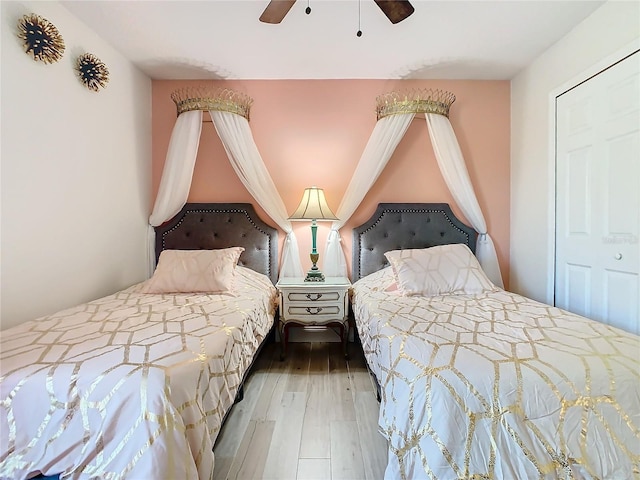 bedroom with ceiling fan and wood finished floors