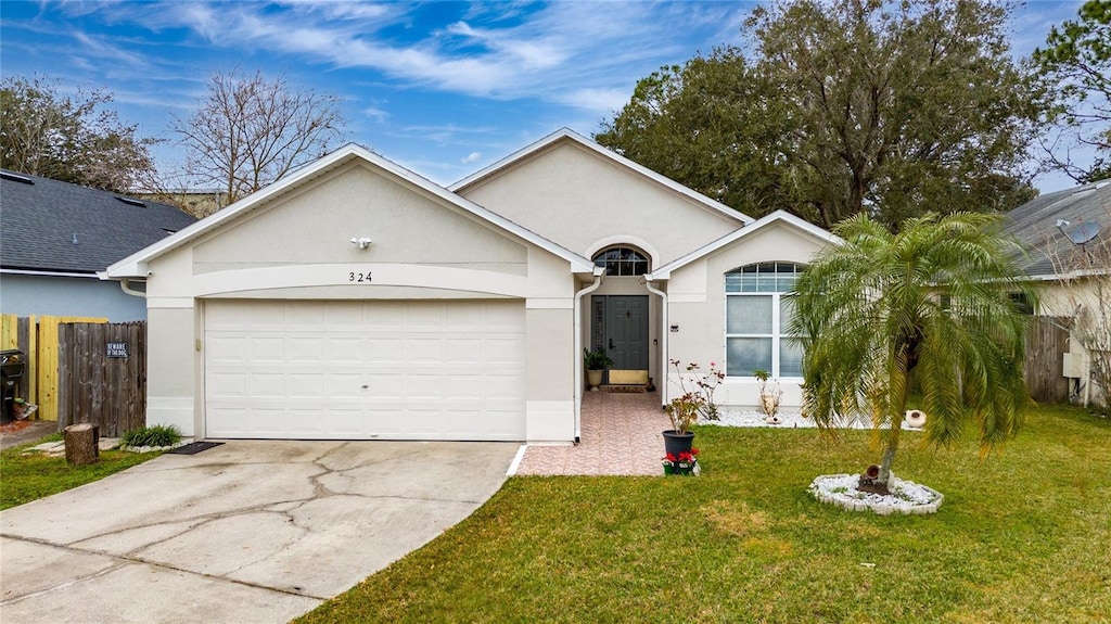 single story home with a garage and a front yard