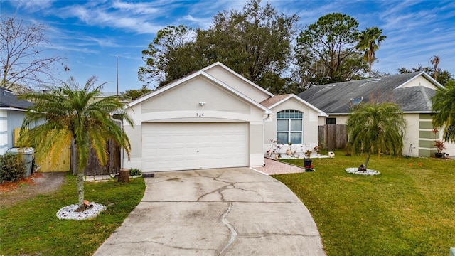 single story home featuring a garage and a front lawn