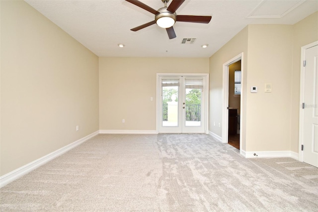 carpeted empty room featuring ceiling fan