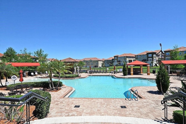 view of pool featuring a gazebo and a patio