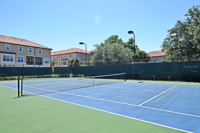 view of sport court with basketball hoop