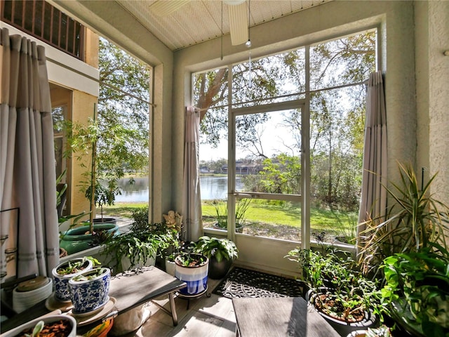 sunroom with a water view and plenty of natural light