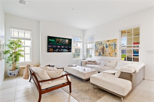 tiled living room featuring a wealth of natural light