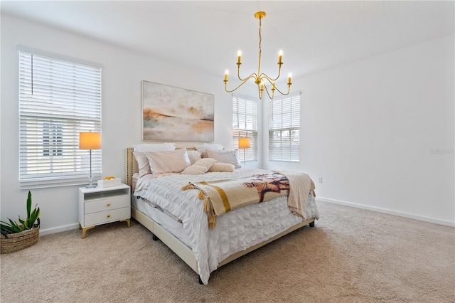 bedroom featuring an inviting chandelier and carpet flooring