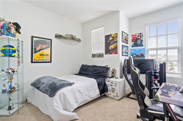 bedroom featuring light carpet