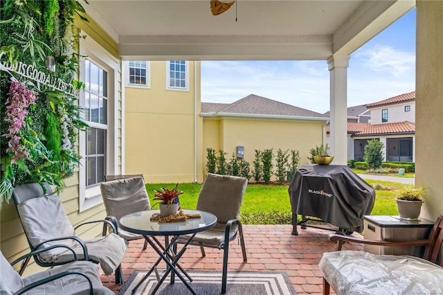 view of patio featuring area for grilling and ceiling fan