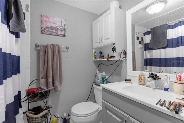 bathroom featuring vanity, a shower with curtain, and toilet