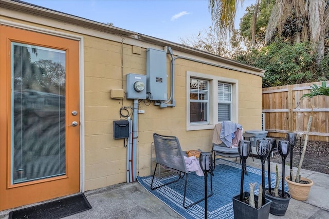 doorway to property with a patio