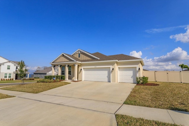 view of front facade featuring a garage and a front yard