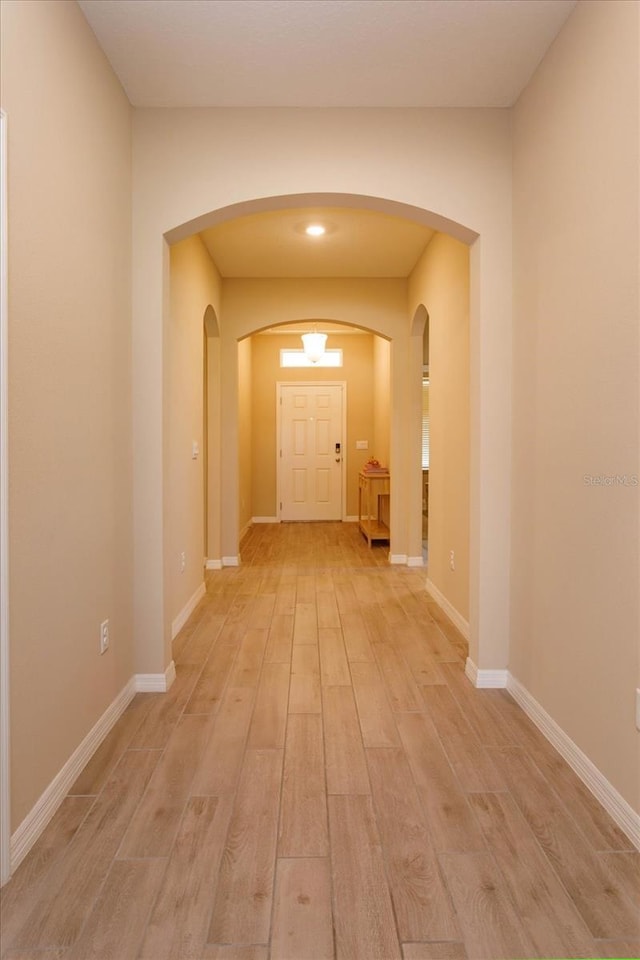 hall with light hardwood / wood-style flooring