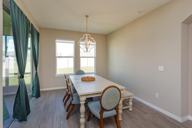 dining room featuring a chandelier and light hardwood / wood-style floors