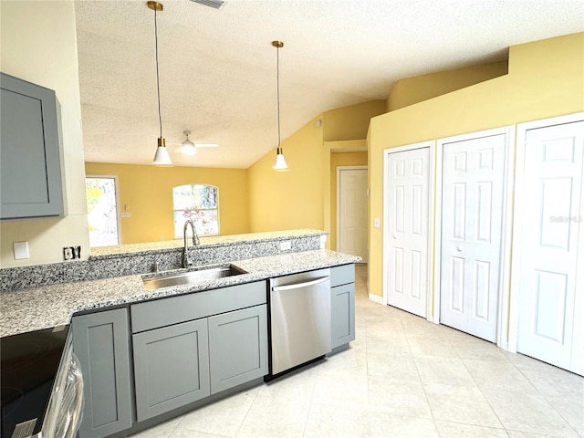 kitchen with sink, hanging light fixtures, gray cabinets, stainless steel appliances, and light stone countertops