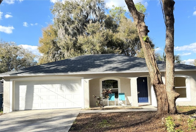 single story home featuring covered porch, a garage, driveway, roof with shingles, and stucco siding