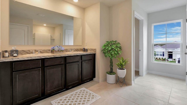 bathroom featuring tile patterned floors and vanity