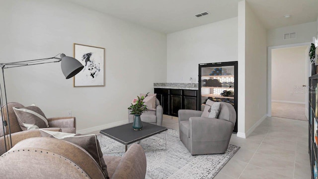 tiled living room featuring sink