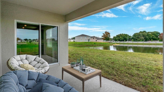 view of patio with a water view
