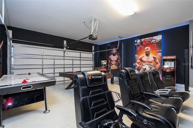 home theater featuring concrete flooring and a textured ceiling