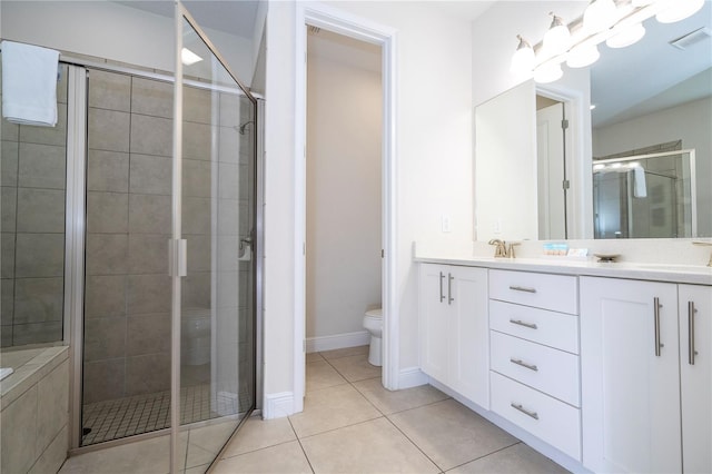 bathroom with an enclosed shower, tile patterned floors, and toilet