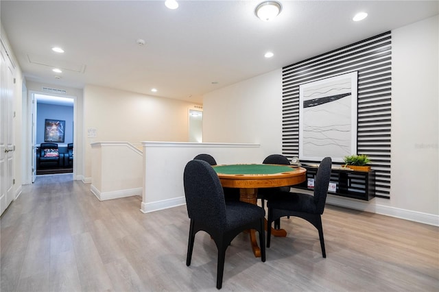 dining space with light wood-type flooring