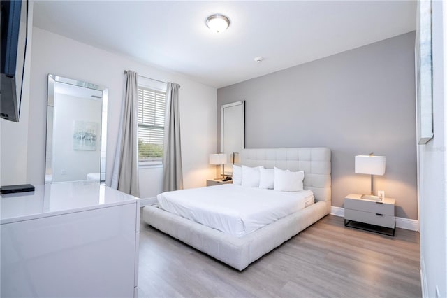 bedroom featuring light wood-type flooring