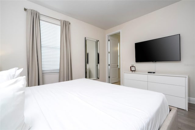 bedroom featuring wood-type flooring